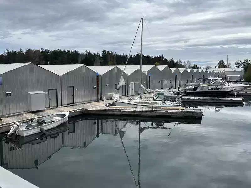 Metal boathouse at North Saanich Marina used for winter boat storage, where engine room temperature and shore power are monitored remotely.