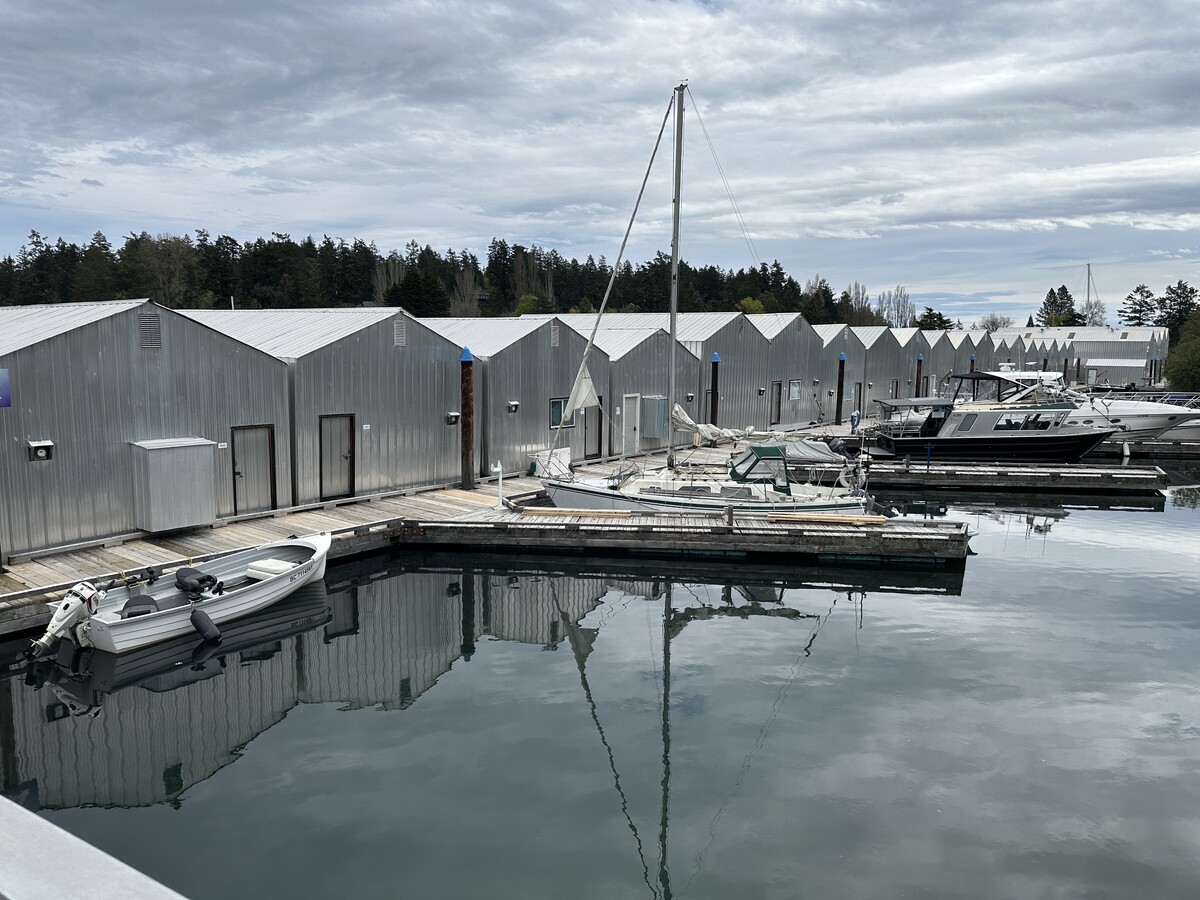 Metal boathouse at North Saanich Marina used for winter boat storage, where engine room temperature and shore power are monitored remotely.