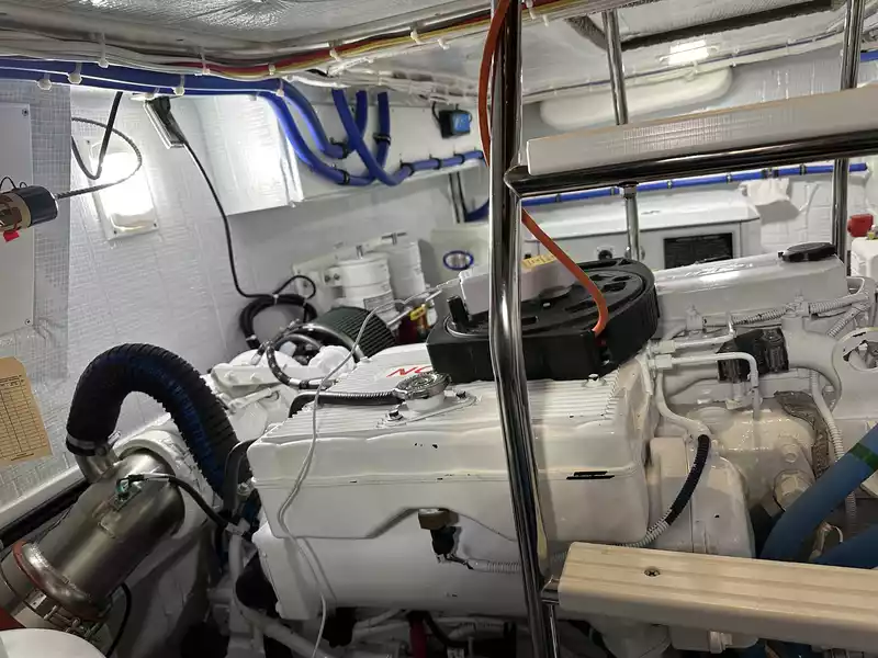 Close-up of an iSocket plugged into an extension cord in the boat’s engine room, used to monitor shore power and engine room temperature during winter storage.