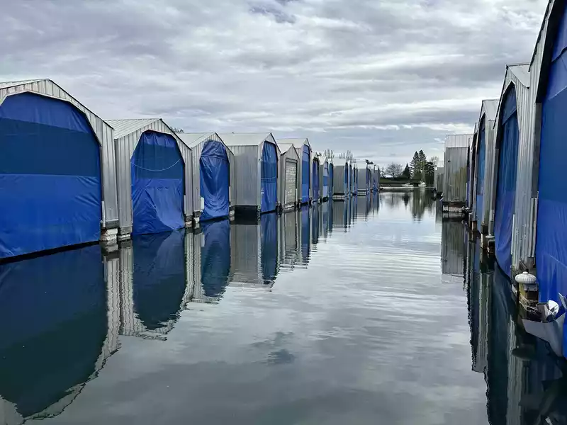 Quiet boathouses over calm water before winter, a good moment to test and fine-tune remote monitoring before leaving the boat for the season.